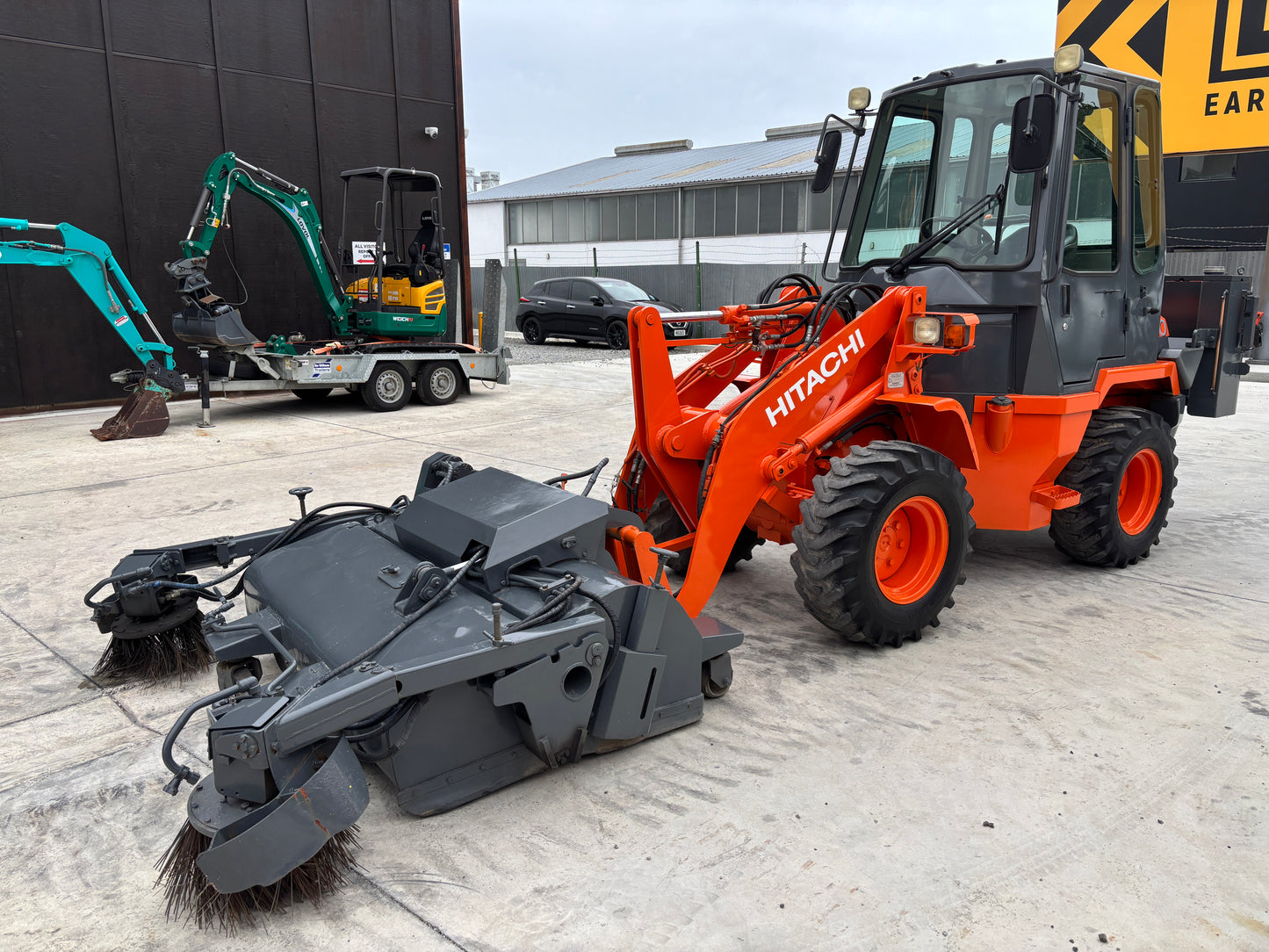 HITACHI LX20-7 LOADER WITH FACTORY HYD POWER SWEEPER ATTACHMENT , LOW HOURS